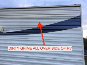 Travel Trailer RV Showing Typical Dirt and Grime on Side of RV