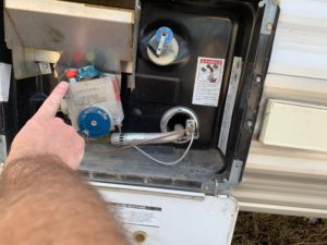 RV hot water heater pilot light button
