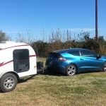 tear drop camper being pulled by small car